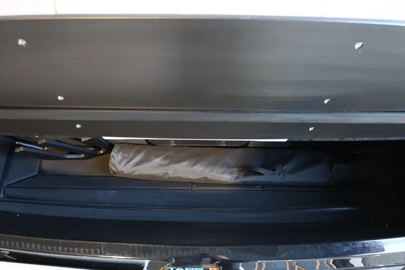 Slide: The Image of Storage compartment of 2025 Tigé 24RZX boat, showcasing spacious interior design. - 20