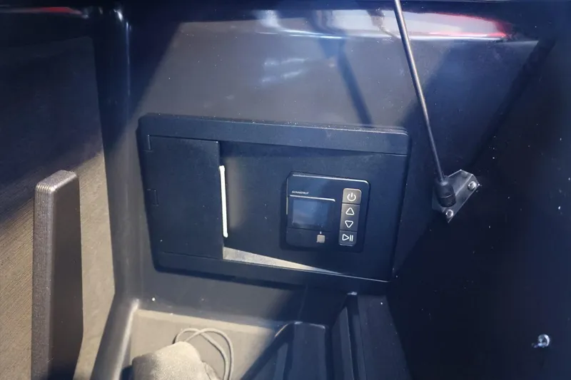 Slide: The Image of 2025 Tigé 24RZX boat interior control panel, featuring sleek design and modern technology. - 21