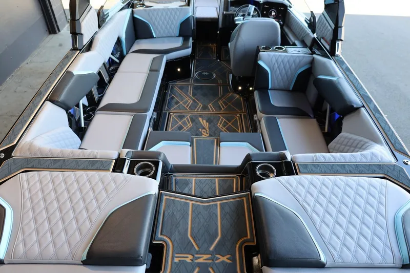 Slide: The Image of Interior of 2025 Tigé 24RZX boat with luxurious seating and modern design. - 22