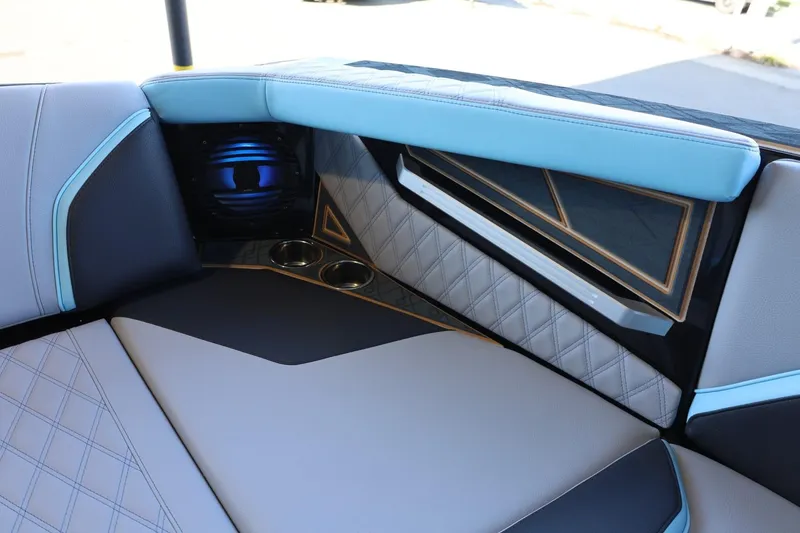 Slide: The Image of 2025 Tigé 24RZX boat interior with modern upholstery and cup holders. - 32