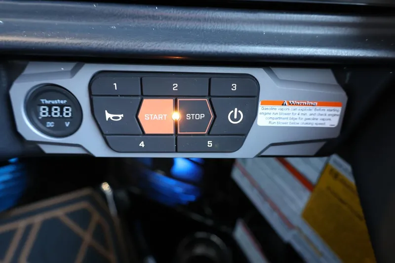 Slide: The Image of Control panel of 2025 Tigé 24RZX boat with start, stop, and power buttons. - 36