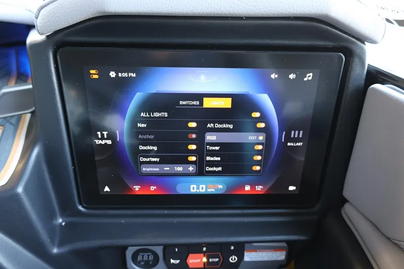 Slide: The Image of Touchscreen control panel in 2025 Tigé 24RZX boat, displaying lighting and ballast settings. - 39