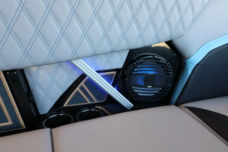 Slide: The Image of 2025 Tigé 24RZX interior with diamond-stitched upholstery and integrated speaker system. - 44