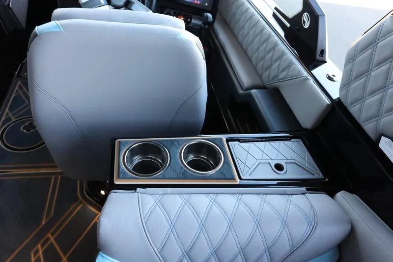 Slide: The Image of Interior of 2025 Tigé 24RZX boat with quilted seats and cup holders. - 48