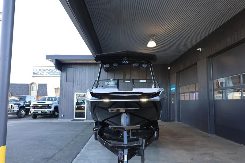 Slide: The Image of 2025 Tigé 24RZX boat displayed at dealership, front view. - 5