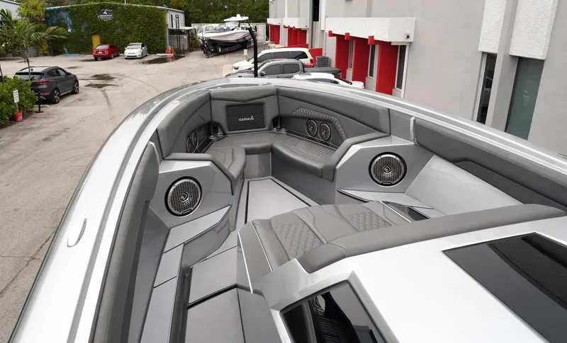 Slide: The Image of 2024 Adrenaline 47 Reaper boat interior with sleek gray seating and modern design. - 10