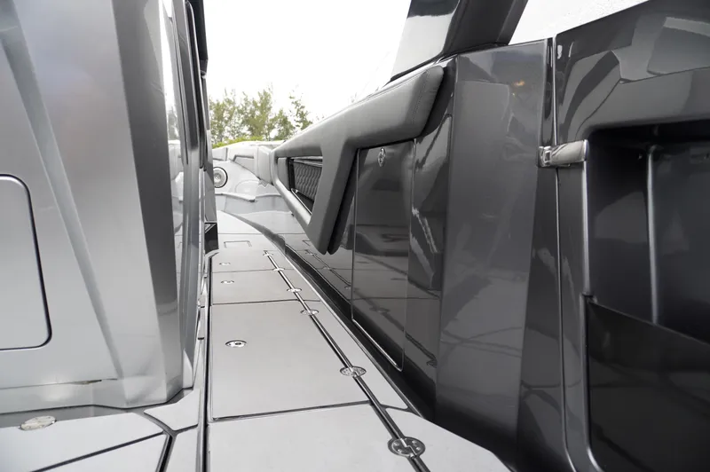 Slide: The Image of 2024 Adrenaline 47 Reaper boat deck, sleek design with modern gray finish. - 17