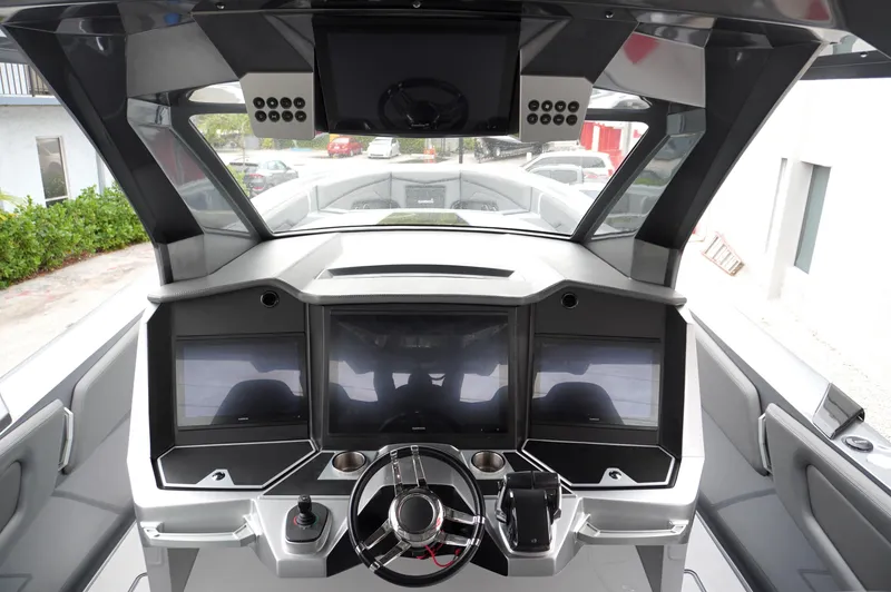 Slide: The Image of 2024 Adrenaline 47 Reaper boat cockpit with advanced navigation displays and sleek design. - 20
