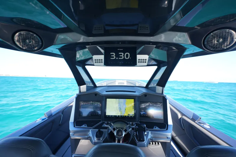 Slide: The Image of Cockpit view of 2024 Adrenaline 47 Reaper boat with advanced navigation displays. - 22