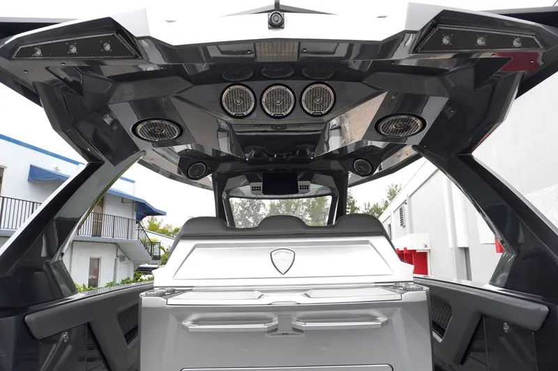 Slide: The Image of Interior view of 2024 Adrenaline 47 Reaper boat, showcasing sleek design and advanced audio system. - 25