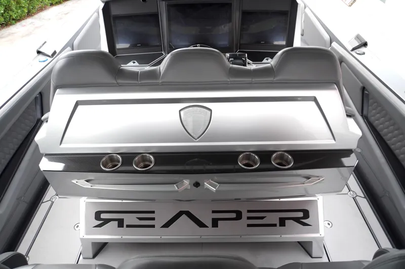 Slide: The Image of 2024 Adrenaline 47 Reaper boat interior with sleek design and modern controls. - 26