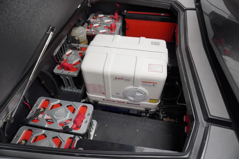 Slide: The Image of 2024 Adrenaline 47 Reaper engine compartment with batteries and generator. - 27