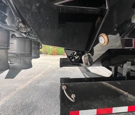 Slide: The Image of 2024 Adrenaline 47 Reaper trailer hitch and suspension detail in parking lot. - 28