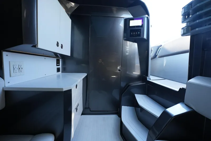 Slide: The Image of Interior of 2024 Adrenaline 47 Reaper boat, featuring sleek cabinetry and modern design. - 29