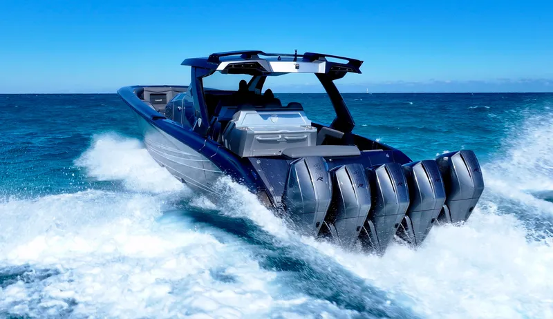Slide: The Image of 2024 Adrenaline 47 Reaper speedboat with multiple engines cruising on open water. - 36
