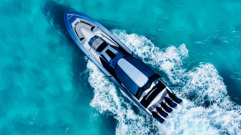 Slide: The Image of 2024 Adrenaline 47 Reaper speedboat cruising on clear turquoise water. - 39