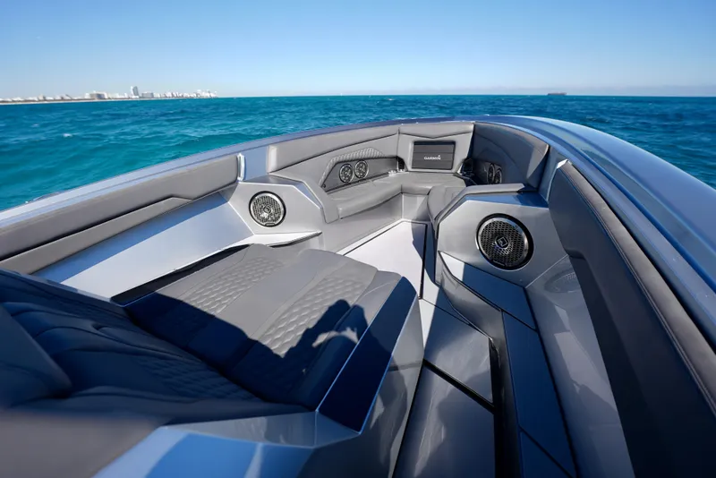 Slide: The Image of 2024 Adrenaline 47 Reaper boat interior with sleek seating and ocean view. - 41