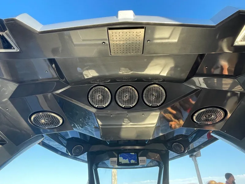 Slide: The Image of 2024 Adrenaline 47 Reaper boat interior with advanced audio system and sleek design. - 45