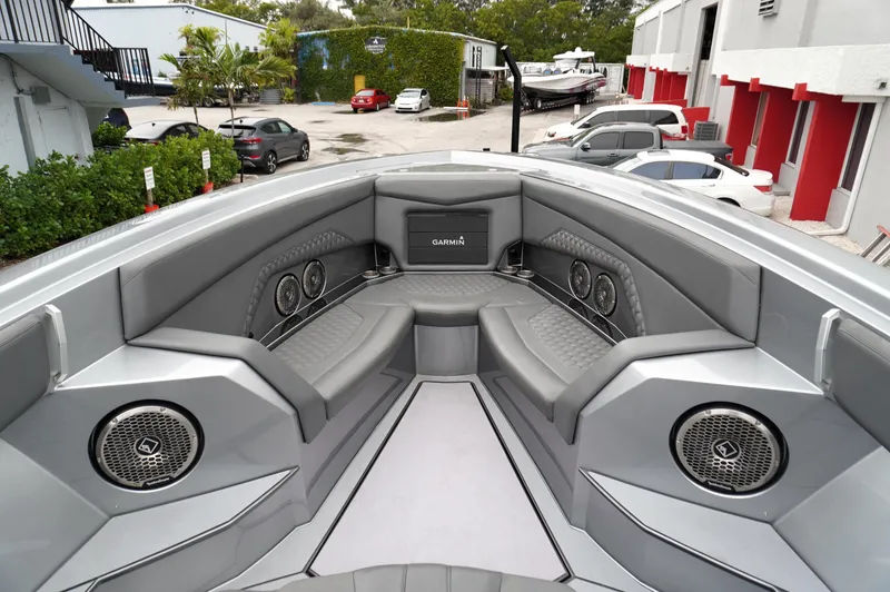 Slide: The Image of 2024 Adrenaline 47 Reaper boat interior with sleek seating and advanced audio system. - 9