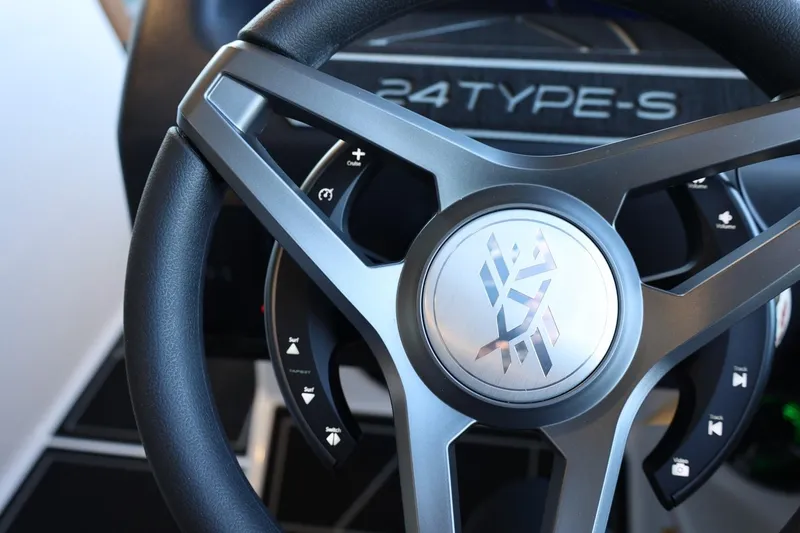 Slide: The Image of Steering wheel of 2025 ATX Surf Boats 24 Type-S, showcasing modern design and controls. - 23