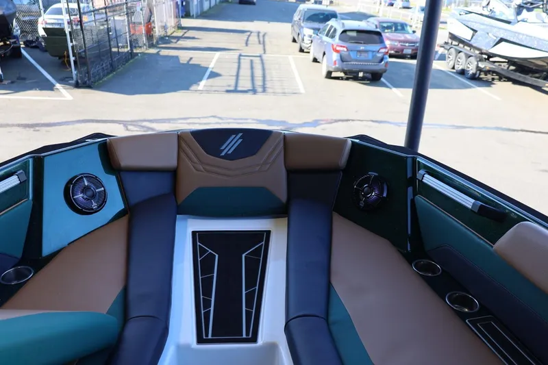 Slide: The Image of 2025 ATX Surf Boats 24 Type-S interior with stylish seating and cup holders. - 25