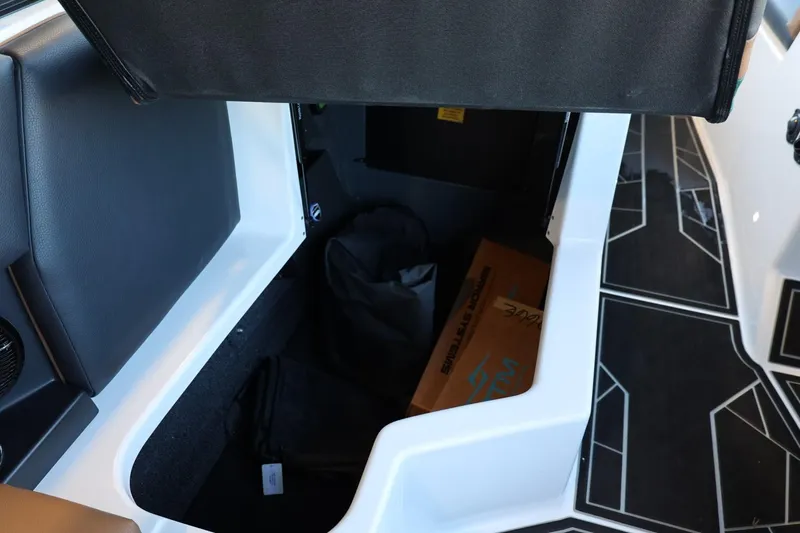 Slide: The Image of Storage compartment in 2025 ATX Surf Boats 24 Type-S, featuring spacious interior and sleek design. - 26