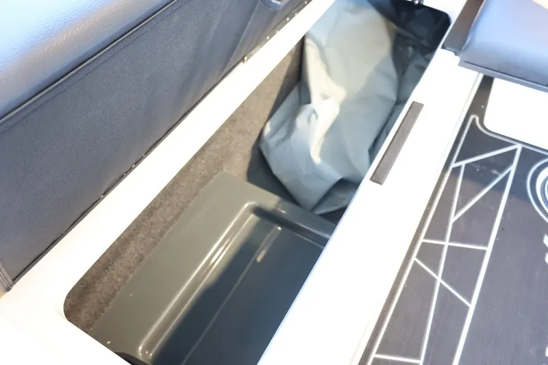 Slide: The Image of 2025 ATX Surf Boats 24 Type-S storage compartment with sleek interior design. - 28