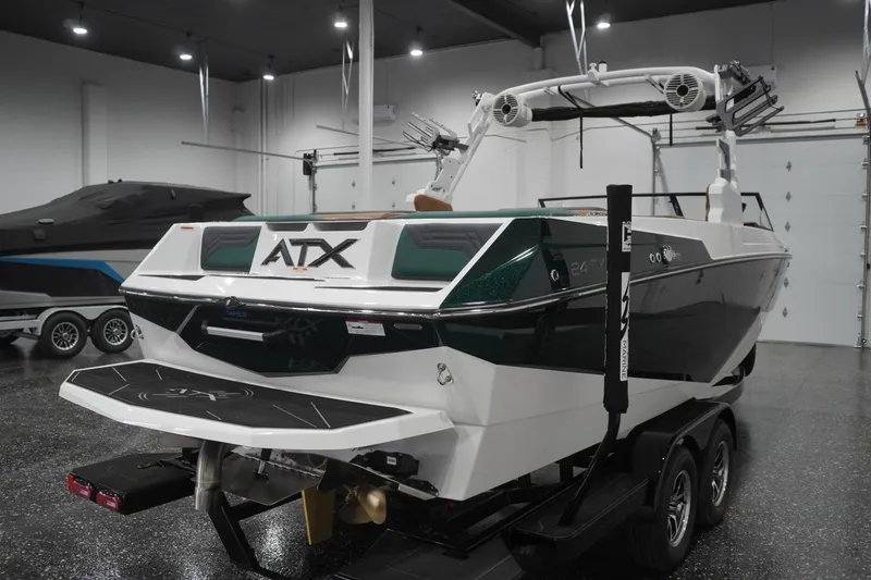 Slide: The Image of 2025 ATX Surf Boats 24 Type-S in showroom, rear view on trailer. - 43