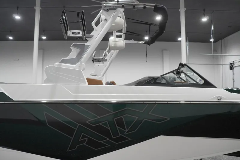 Slide: The Image of 2025 ATX Surf Boats 24 Type-S in showroom, featuring sleek design and modern tower. - 47