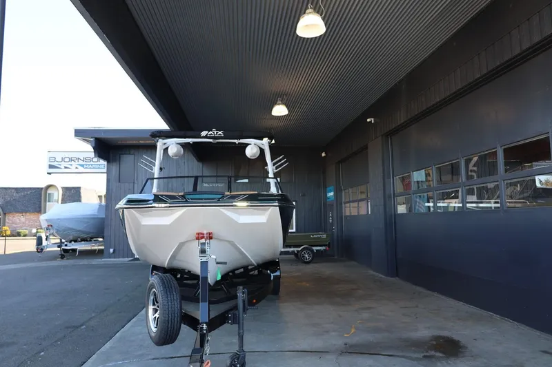 Slide: The Image of 2025 ATX Surf Boats 24 Type-S in showroom, front view. - 5