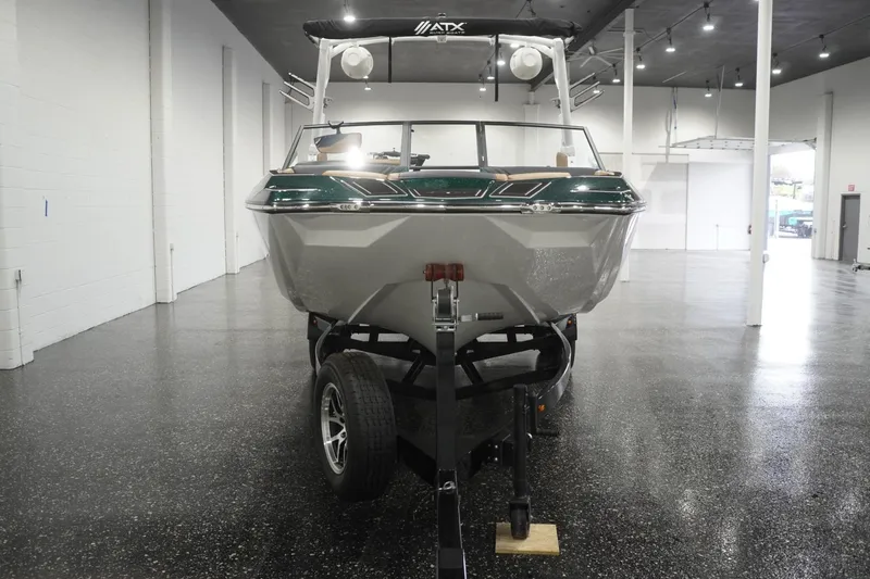 Slide: The Image of 2025 ATX Surf Boats 24 Type-S on trailer in showroom, front view. - 53
