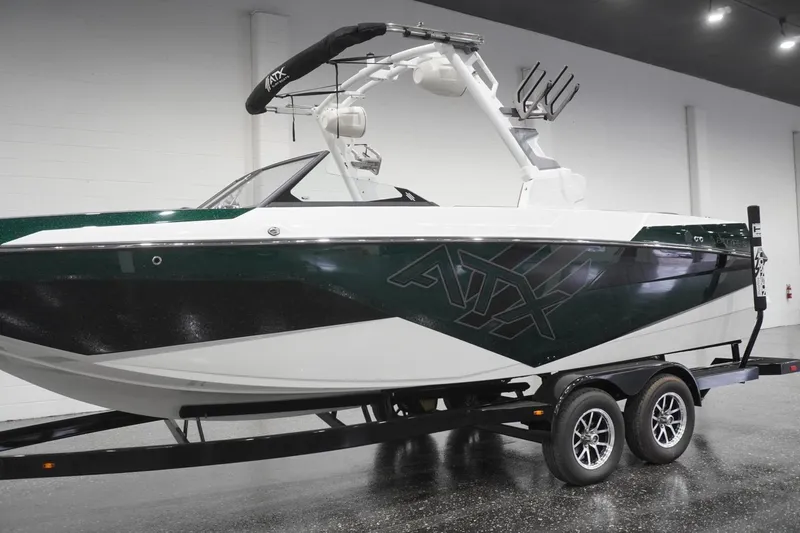 Slide: The Image of 2025 ATX Surf Boats 24 Type-S on trailer in showroom. - 57