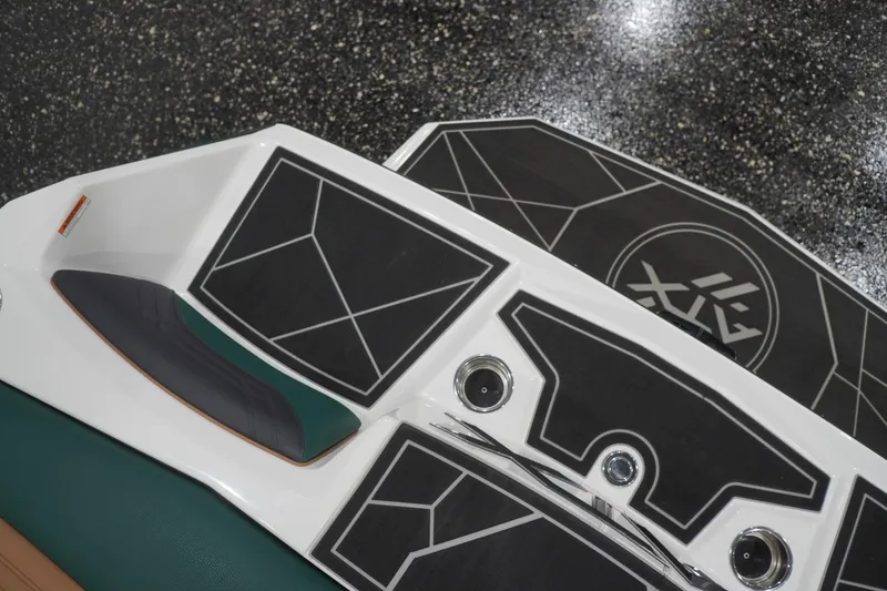Slide: The Image of 2025 ATX Surf Boats 24 Type-S deck with sleek black and white geometric design. - 60