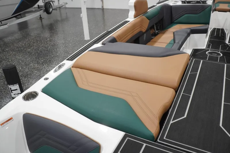 Slide: The Image of 2025 ATX Surf Boats 24 Type-S interior with stylish tan, green, and gray seating. - 63
