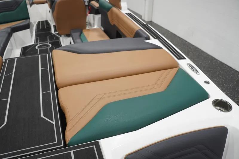 Slide: The Image of 2025 ATX Surf Boats 24 Type-S interior with tan, green, and gray seating. - 64