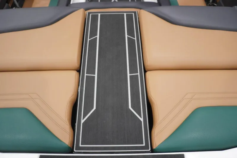 Slide: The Image of 2025 ATX Surf Boats 24 Type-S interior with tan and teal seating, modern design. - 65