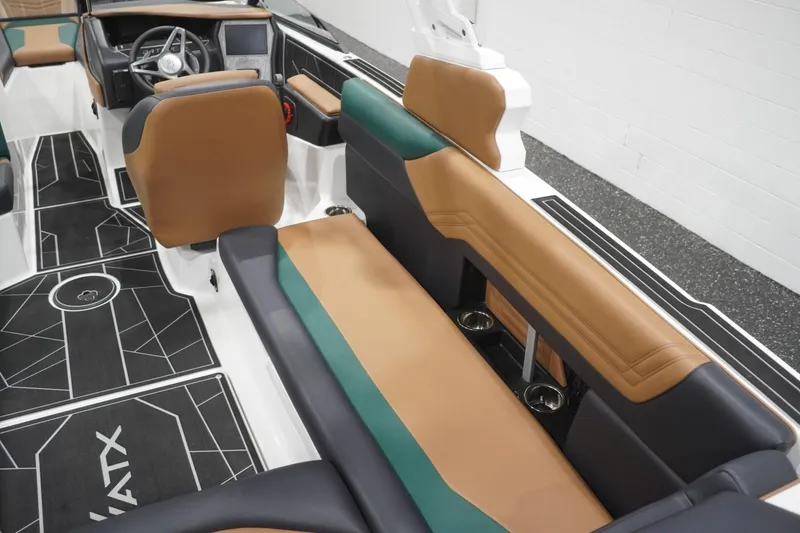 Slide: The Image of 2025 ATX Surf Boats 24 Type-S interior with brown and black seating, modern dashboard, and sleek design. - 71