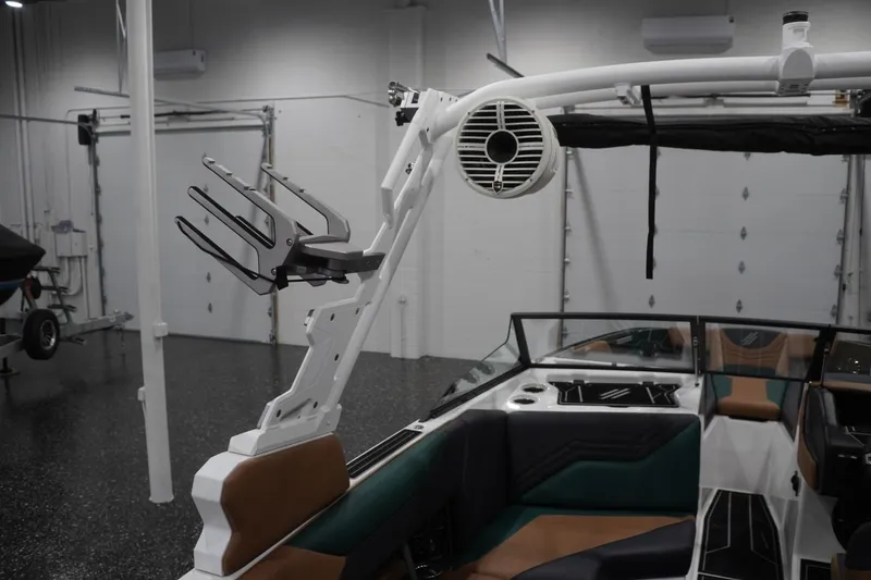 Slide: The Image of 2025 ATX Surf Boats 24 Type-S interior with speaker and wakeboard rack. - 74