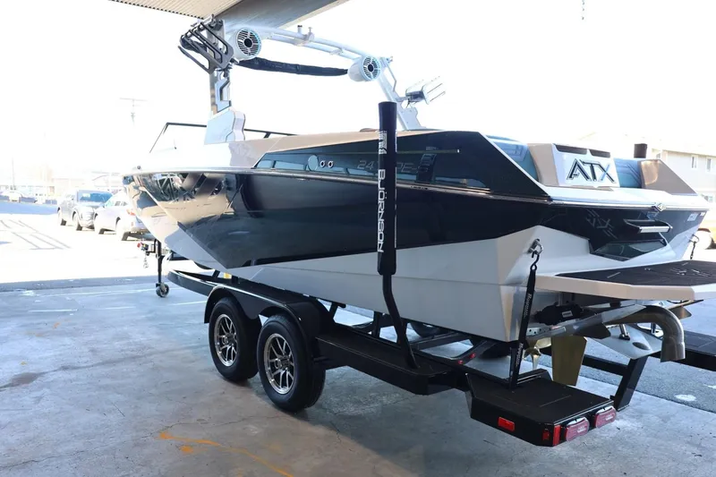 Slide: The Image of 2025 ATX Surf Boats 24 Type-S on trailer in a garage setting. - 9