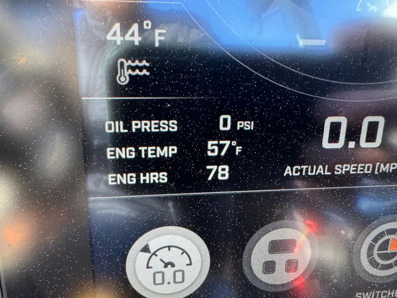 Slide: The Image of 2023 Tigé Z3 dashboard displaying temperature, oil pressure, engine hours, and speed. - 17