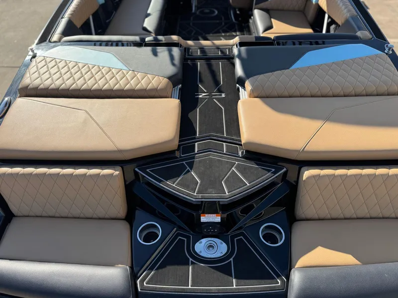 Slide: The Image of 2023 Tigé Z3 boat interior with tan and black quilted seating. - 7