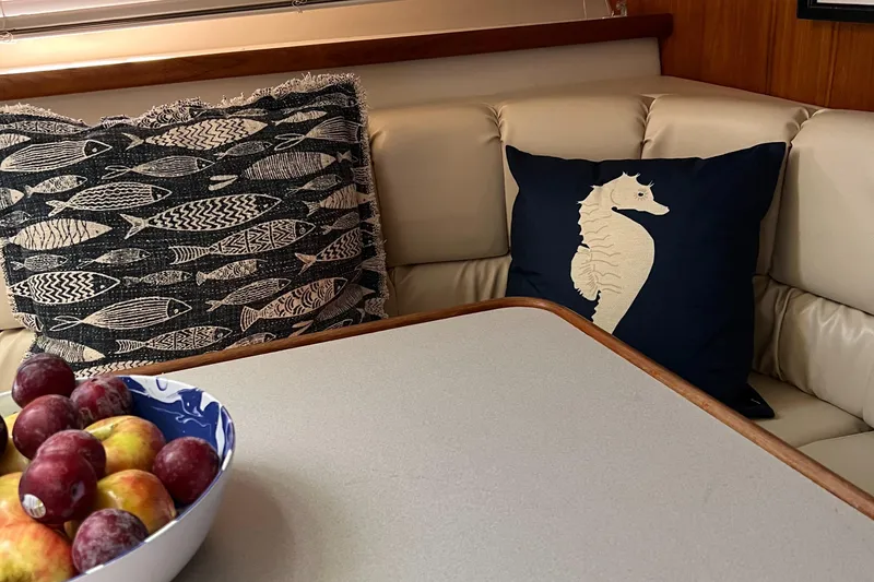 Slide: The Image of Cozy interior of 1995 Carver 440 Yacht with decorative pillows and fruit bowl. - 17