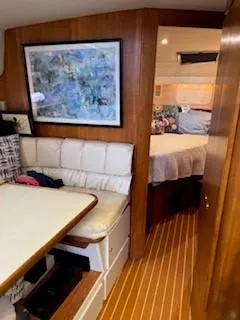 Slide: The Image of Interior of 1995 Carver 440 Aft Cabin Motor Yacht with seating and bedroom. - 23