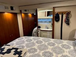 Slide: The Image of Interior of 1995 Carver 440 Aft Cabin Motor Yacht with cozy bedroom and bathroom. - 28