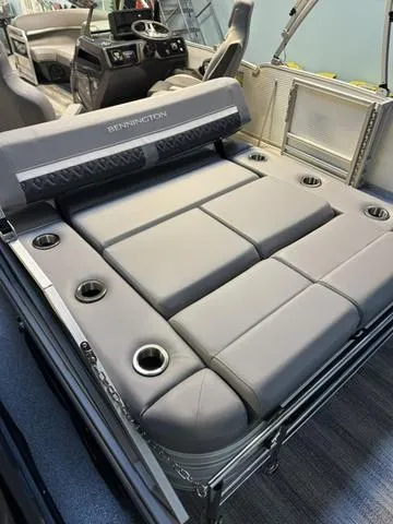 Slide: The Image of 2025 Bennington M Swingback 22 MSB pontoon boat with luxurious seating and cup holders. - 6