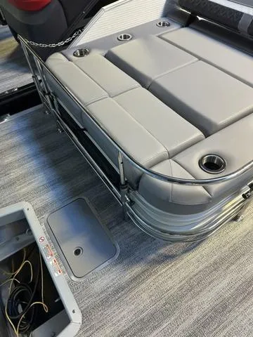 Slide: The Image of 2025 Bennington M Swingback 22 MSB boat interior with cushioned seating and cup holders. - 7