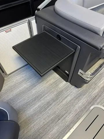 Slide: The Image of 2025 Bennington M Swingback 22 MSB interior with pull-out table feature. - 8