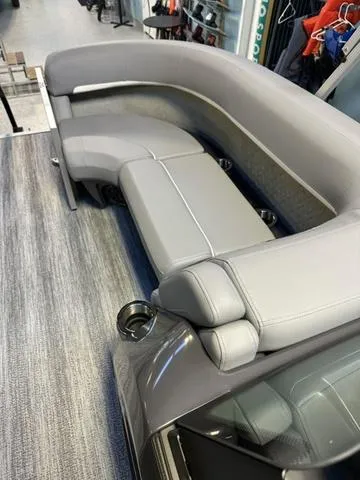 Slide: The Image of 2025 Bennington M Swingback 22 MSB boat interior with gray seating and modern design. - 9