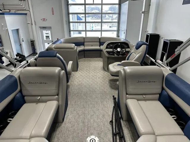 Slide: The Image of 2024 South Bay 222RS LE 2.75 pontoon boat interior with plush seating and modern dashboard. - 5
