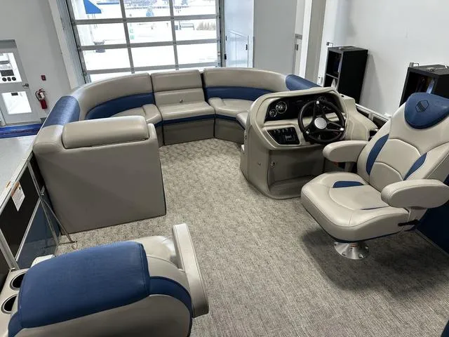 Slide: The Image of 2024 South Bay 222RS LE 2.75 pontoon boat interior with plush seating and modern helm. - 6